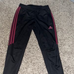 Adidas joggers. They’re maroon and black. Slightly worn no rips or tears.